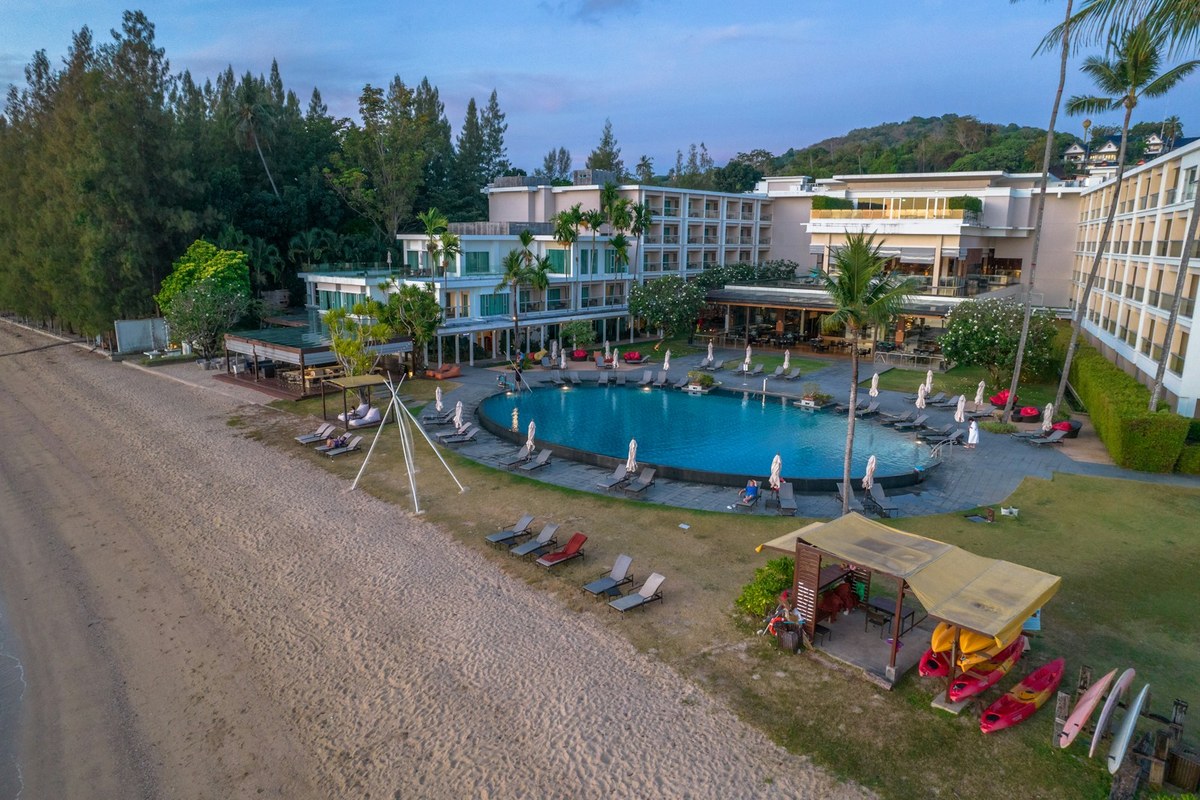 An aerial view of a resort with a swimming pool